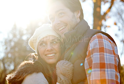 Buy stock photo Couple, smile and hug for love in forest with care, warm clothes and bonding together for outdoor date. Man, woman and happy for embrace in woods with respect, loyalty and fashion for cold climate