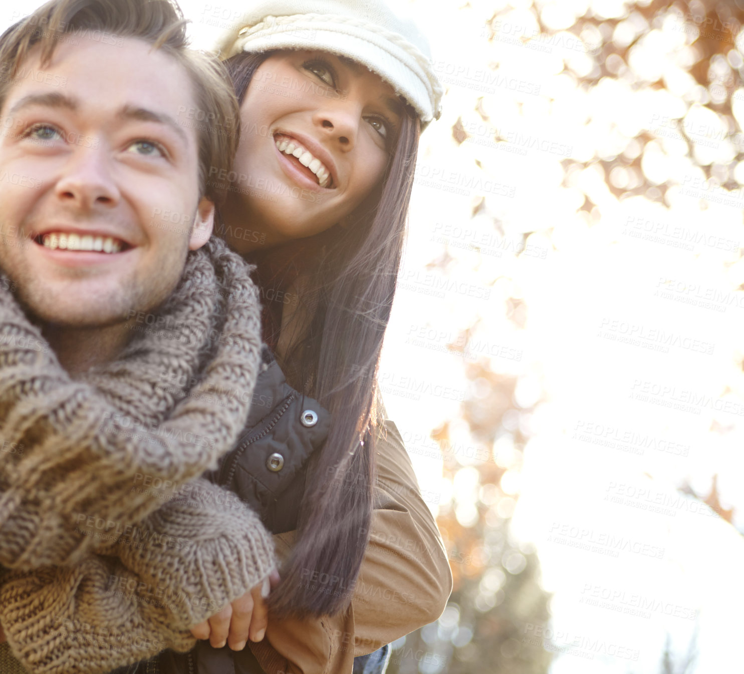 Buy stock photo People, couple and smile in forest with piggyback for bonding, support and trust in Germany. Love, relationship and happy in outdoor or woods for holiday, sightseeing and adventure in winter