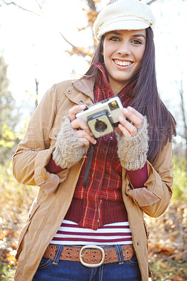 Buy stock photo Woman, portrait and camera for photography outdoor with adventure travel, explore nature and sightseeing memory. Smile, female photographer with vintage equipment for scenery of location picture