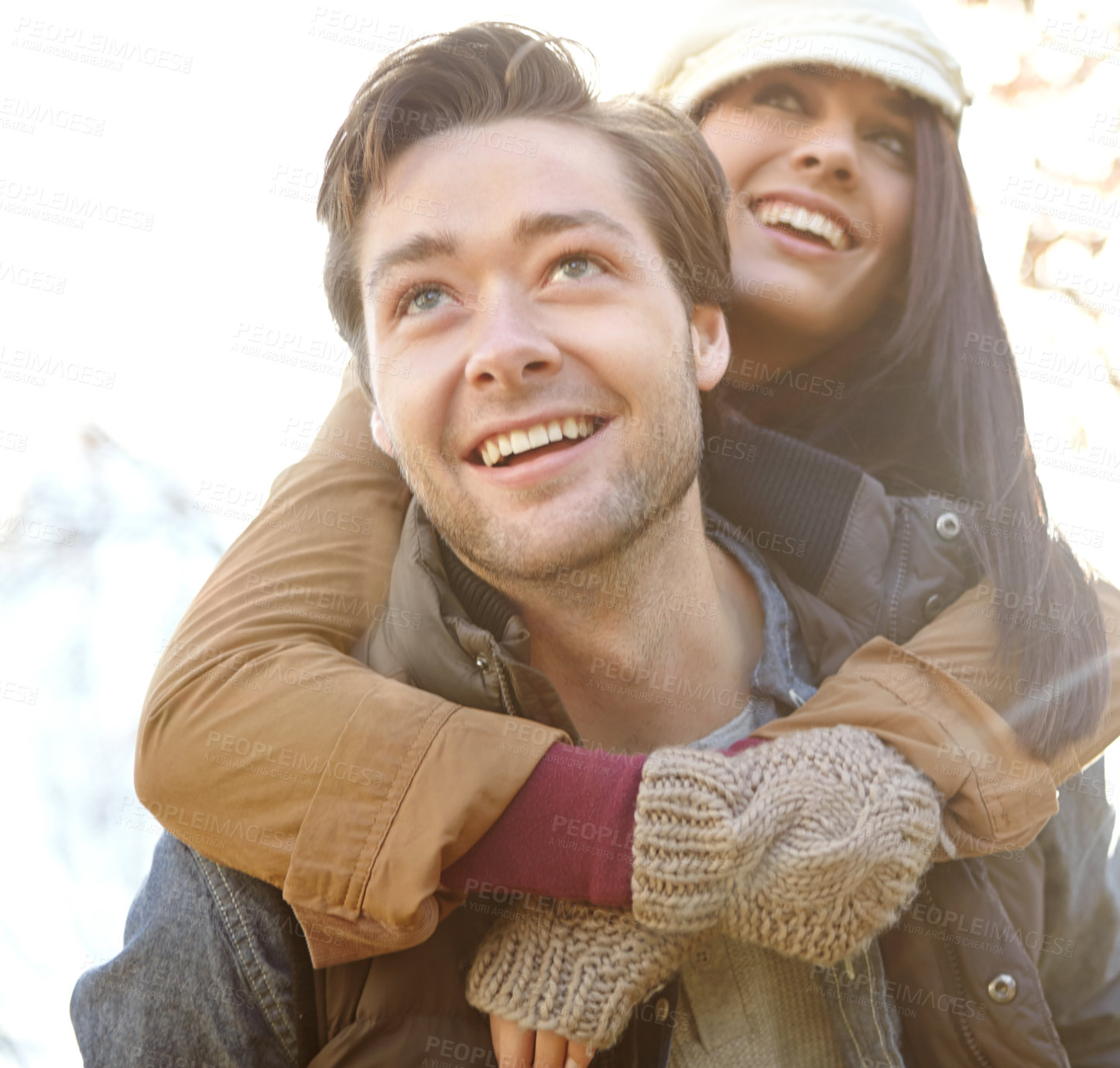 Buy stock photo People, couple and smile in outdoor with piggyback for bonding, support and trust in Germany. Love, relationship and happy in forest or woods for holiday, sightseeing and adventure in winter