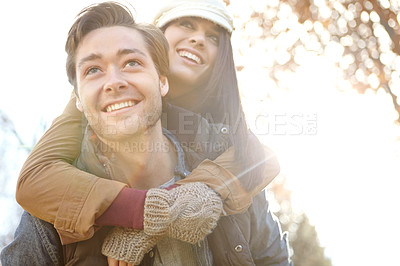 Buy stock photo Happy couple, winter and piggyback in forest for outdoor date with love, warm clothes and security. Smile, nature and man carry woman with fashion for cold climate, bonding together and hug for care