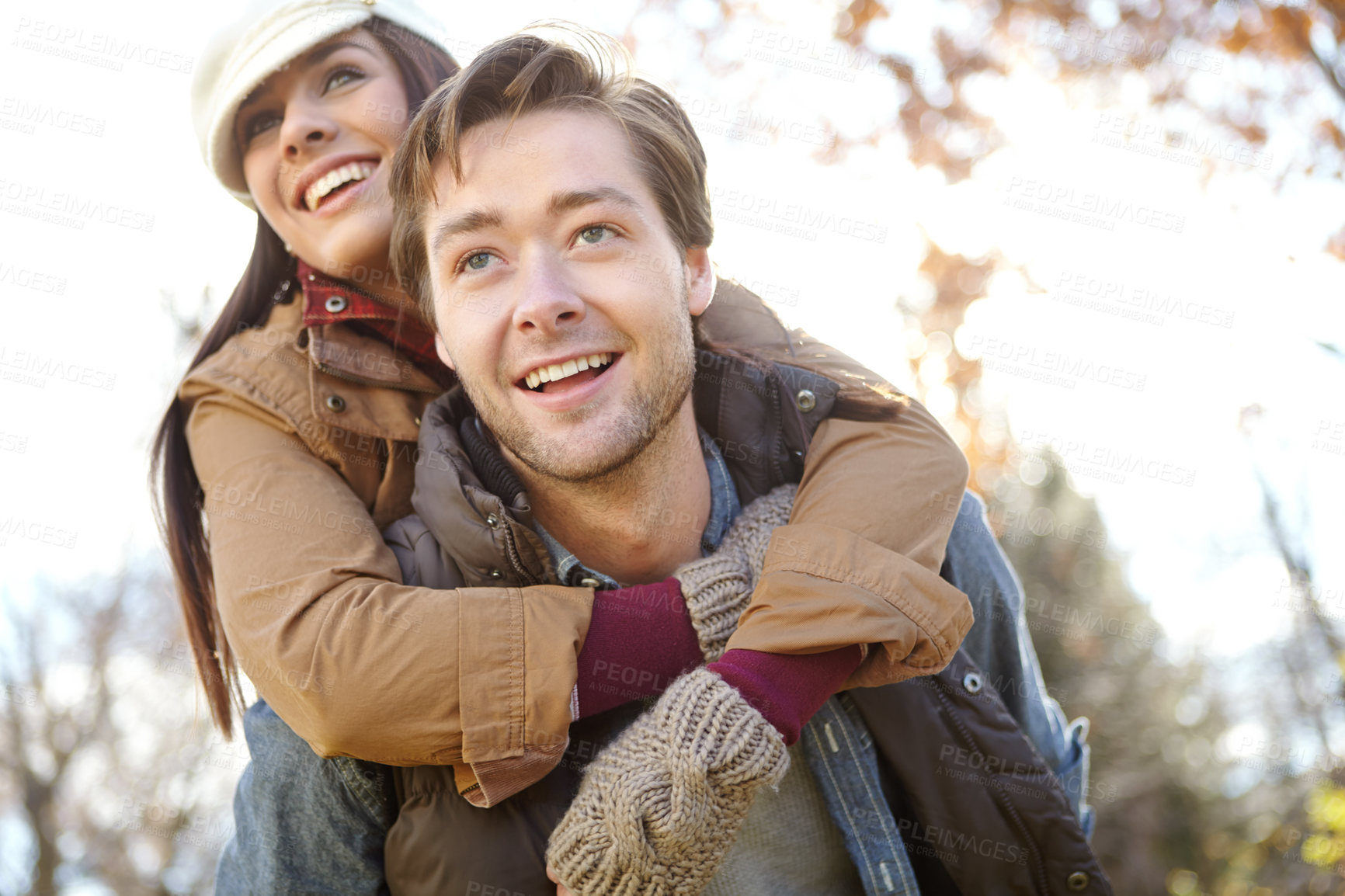 Buy stock photo Relationship, couple and happy in forest with piggyback for bonding, support and trust in Germany. Love, people and smile in park or woods for holiday, sightseeing and adventure in winter for break