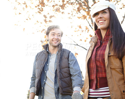 Buy stock photo Woman, man and walking with nature for forest trip, bonding and travel in winter countryside. Smile, love and couple holding hands for morning holiday, vacation or woods picnic or hiking adventure