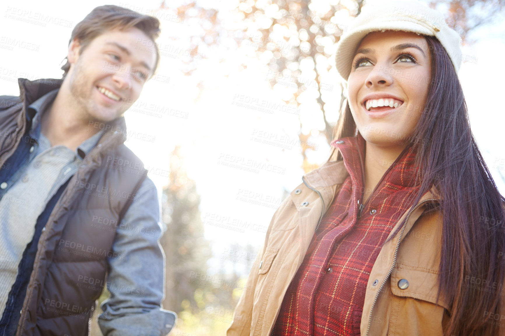 Buy stock photo Woman, man and smile with couple for forest trip, bonding and travel in winter countryside. Walk, love and people holding hands for morning holiday, vacation or woods with nature hiking adventure