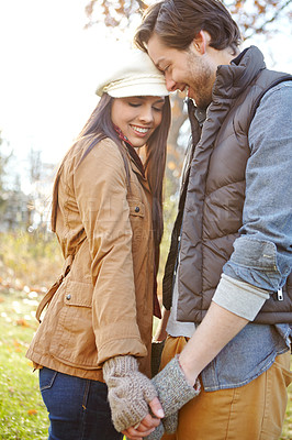 Buy stock photo Holding hands, love and couple in nature for winter vacation, getaway or holiday together for anniversary. Happy, connection and young man and woman hug with care at date on weekend trip in Russia.