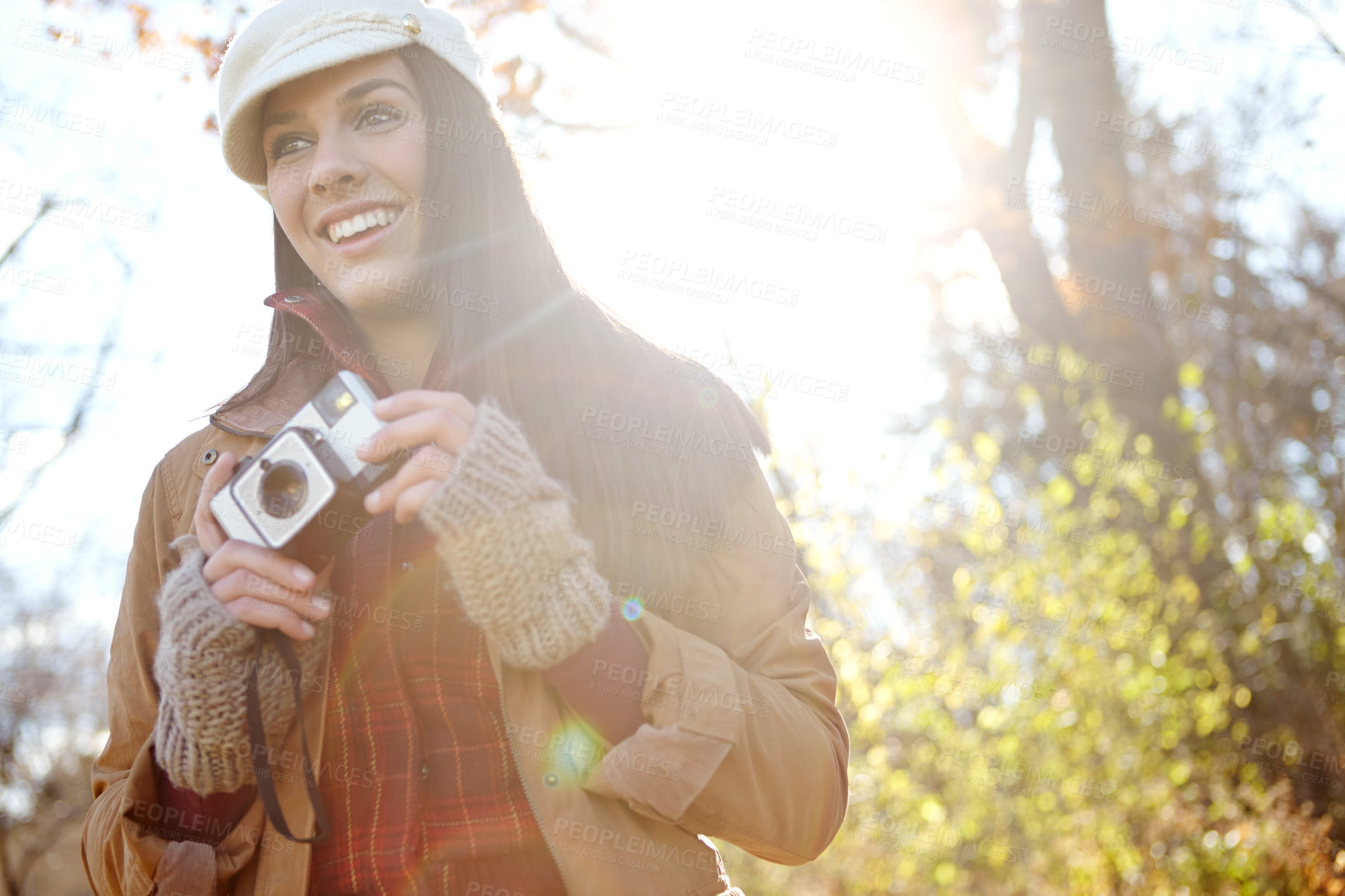 Buy stock photo Thinking, woman and camera for photography outdoor with adventure travel, explore nature and sightseeing memory. Smile, female photographer with vintage equipment for planning of location picture