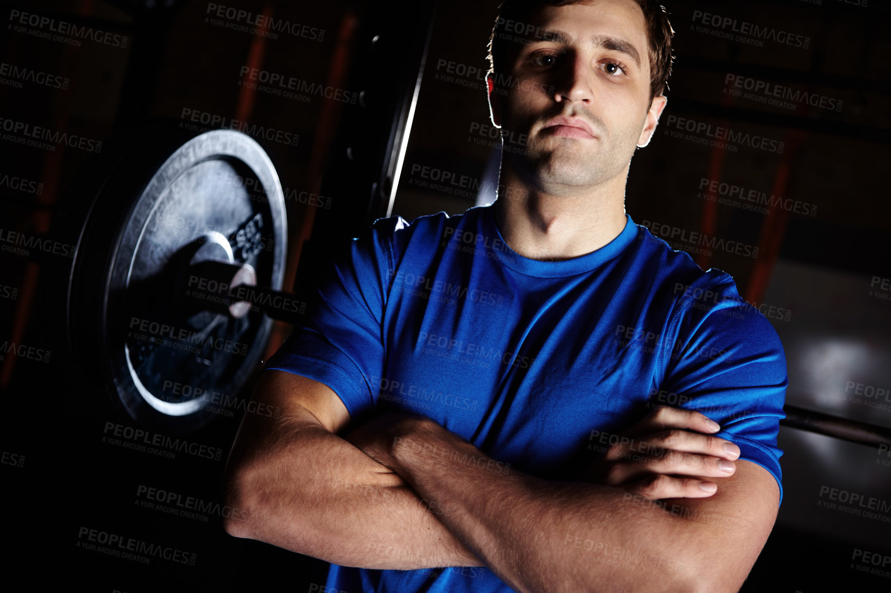 Buy stock photo Man, serious and confidence in gym for fitness with smith machine for squats and muscle development. Athlete, face and crossed arms in portrait with barbell weights for exercise, health and wellness
