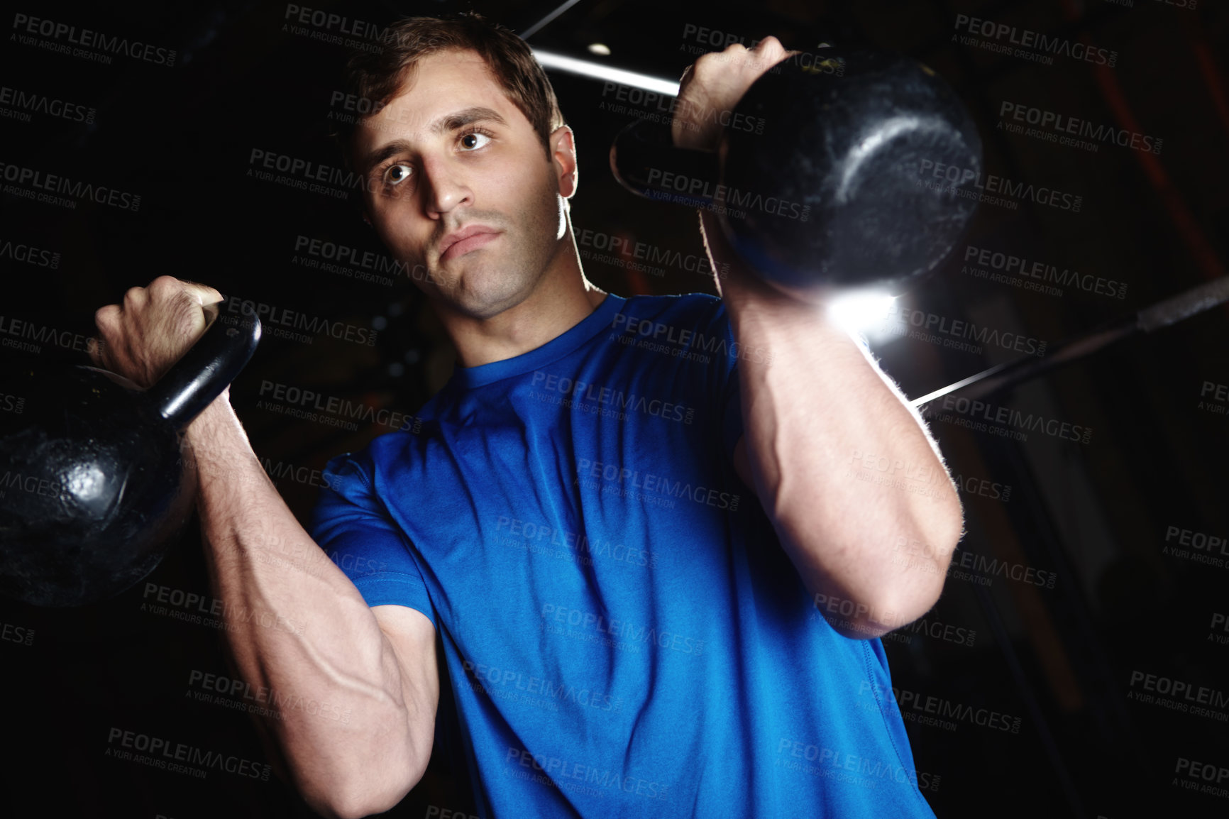 Buy stock photo Man, gym and kettlebell for exercise or fitness for balance, coordination and muscle toning in arms. Male person, weights and physical cardio for cardiovascular health, endurance and core strength.