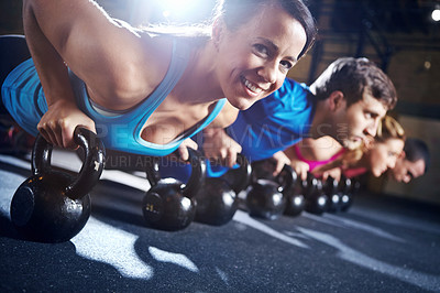 Buy stock photo Push up, gym and portrait of woman with kettlebell, smile and commitment to body workout together. Bodybuilder, group and people in exercise class with dumbbells, power fitness training and teamwork