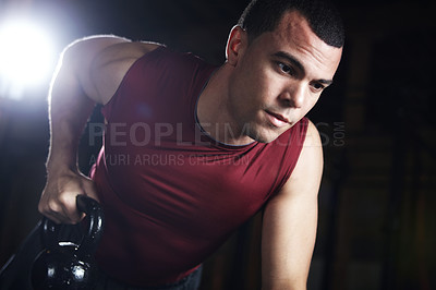 Buy stock photo Man, fitness and kettlebell for weightlifting in gym for workout, power training or bodybuilding performance. Male bodybuilder, equipment and balance, muscle growth and sports exercise of competition