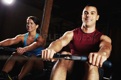 Buy stock photo Fitness, people and rowing machine at gym for core workout, abs training and muscle growth of resilience. Athlete, team and equipment for arms exercise, cardio performance and sports centre of health