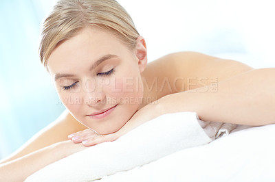 Buy stock photo Eyes closed, massage and relax with woman at spa as customer on table for break, treatment or wellness. Dreaming, luxury and peace with person on bed as salon client for comfort or stress relief