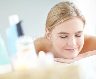 Buy stock photo Massage, pamper and wellness with woman at spa as customer on table for break, treatment or relax. Luxury, peace and smile with happy person on bed as salon client for comfort or stress relief