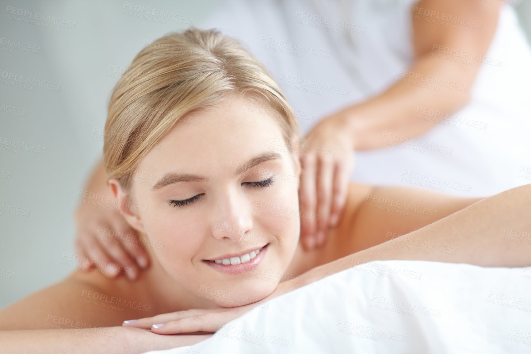 Buy stock photo Happy, massage and relax with woman at spa as customer on table for break, treatment or wellness. Luxury, peace and satisfaction with smile of person on bed as salon client for natural stress relief