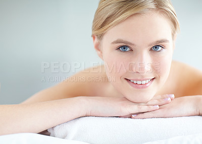 Buy stock photo Massage, pamper and portrait with woman at spa as customer on table for break, treatment or wellness. Face, luxury and relax with person on background at salon for comfort or stress relief smile