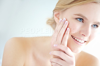 Buy stock photo Beauty, skincare and smile with natural woman in studio on white background for cosmetics or dermatology. Face, satisfaction and thinking with happy person touching cheek for treatment results