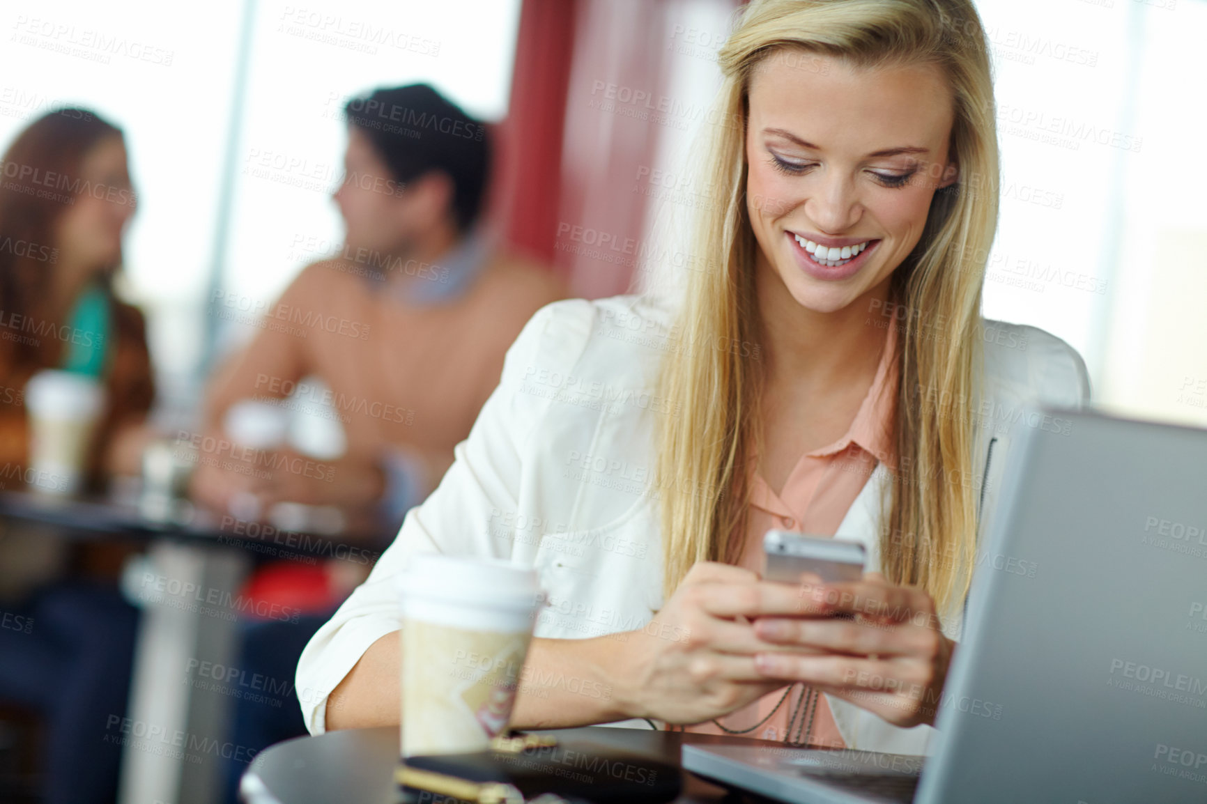 Buy stock photo Reading, phone and happy woman in coffee shop for relax, remote work or typing email online. Scroll, mobile and customer at cafe table with digital nomad or virtual assistant with schedule on laptop