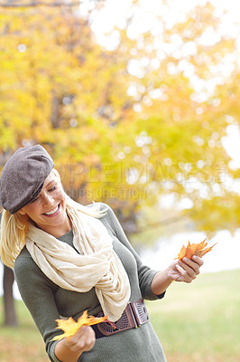 Buy stock photo Fashion, happy and woman with leaves in nature for Autumn weather on holiday, getaway or vacation. Smile, outdoor and female person from Denmark with stylish outfit in park or field on weekend trip.