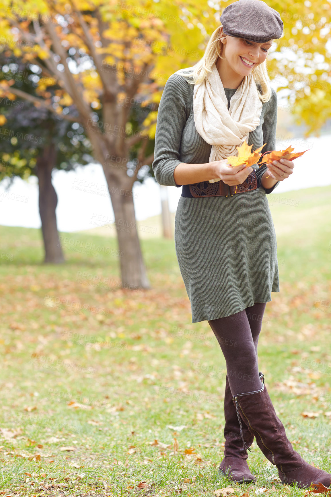 Buy stock photo Autumn, leaves and woman with smile in park for outdoor holiday, adventure and change of season. Environment, female person and happy with foliage in nature for peace, travel and vacation in Denmark