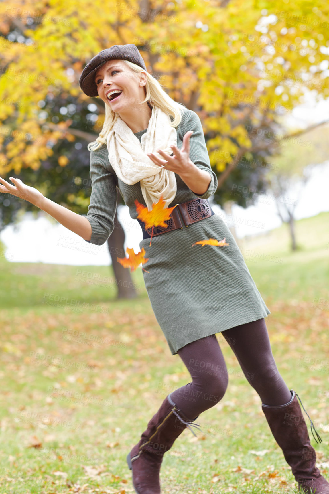 Buy stock photo Woman, happy and leaf in park during autumn season for freedom, joy and playful outdoor on holiday. Female person, adventure and trees in nature in fall weather for travel, vacation and positive mood