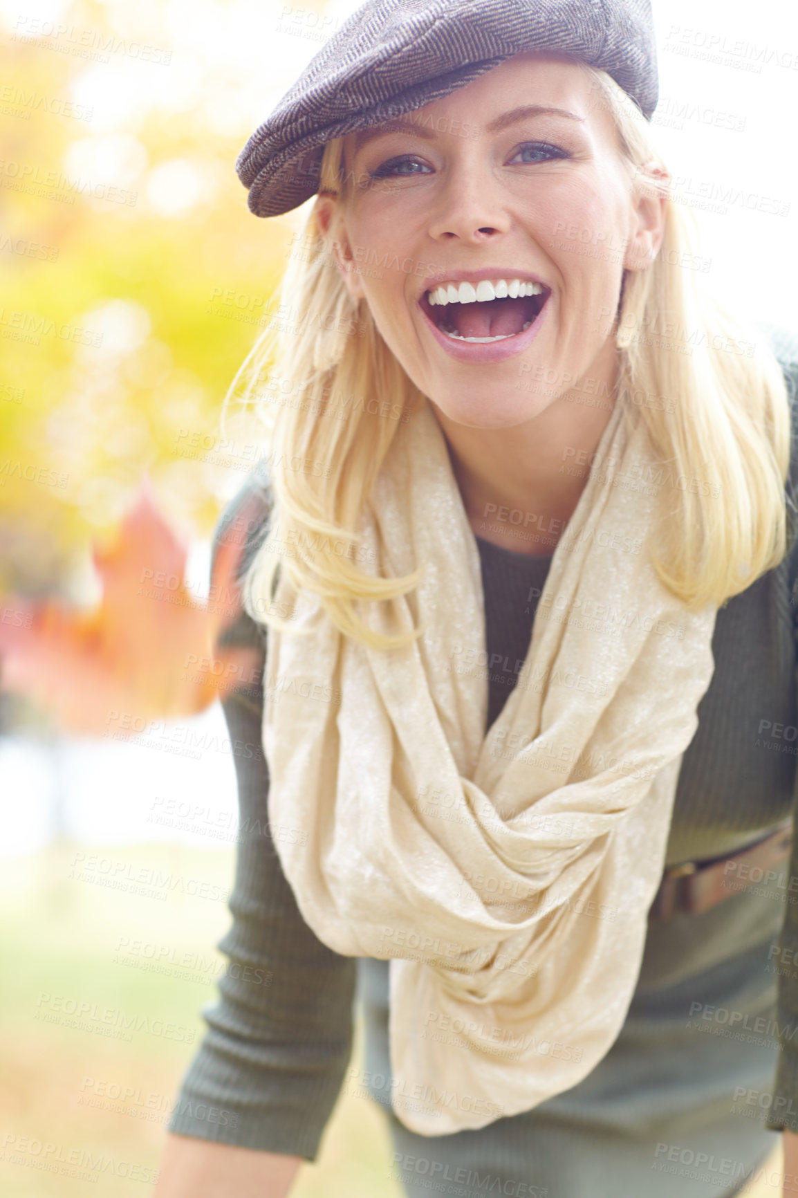 Buy stock photo Woman, portrait and leaf in park during autumn season for leisure, joy and playful outdoor on holiday. Female person, peace and trees in nature in fall weather for travel, vacation and positive mood