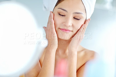 Buy stock photo Asian woman, bathroom and skincare for beauty, facial or moisturizer for change with eyes closed in home. Person, towel and grooming with mirror, cosmetics or happy for results for health in morning