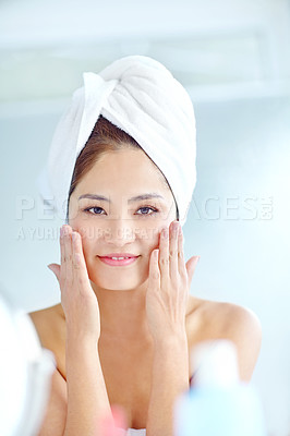 Buy stock photo Asian woman, bathroom and beauty with smile, face or moisturizer bottle in portrait for benefits in home. Person, towel and grooming routine with cosmetics, hands and results with skincare in morning