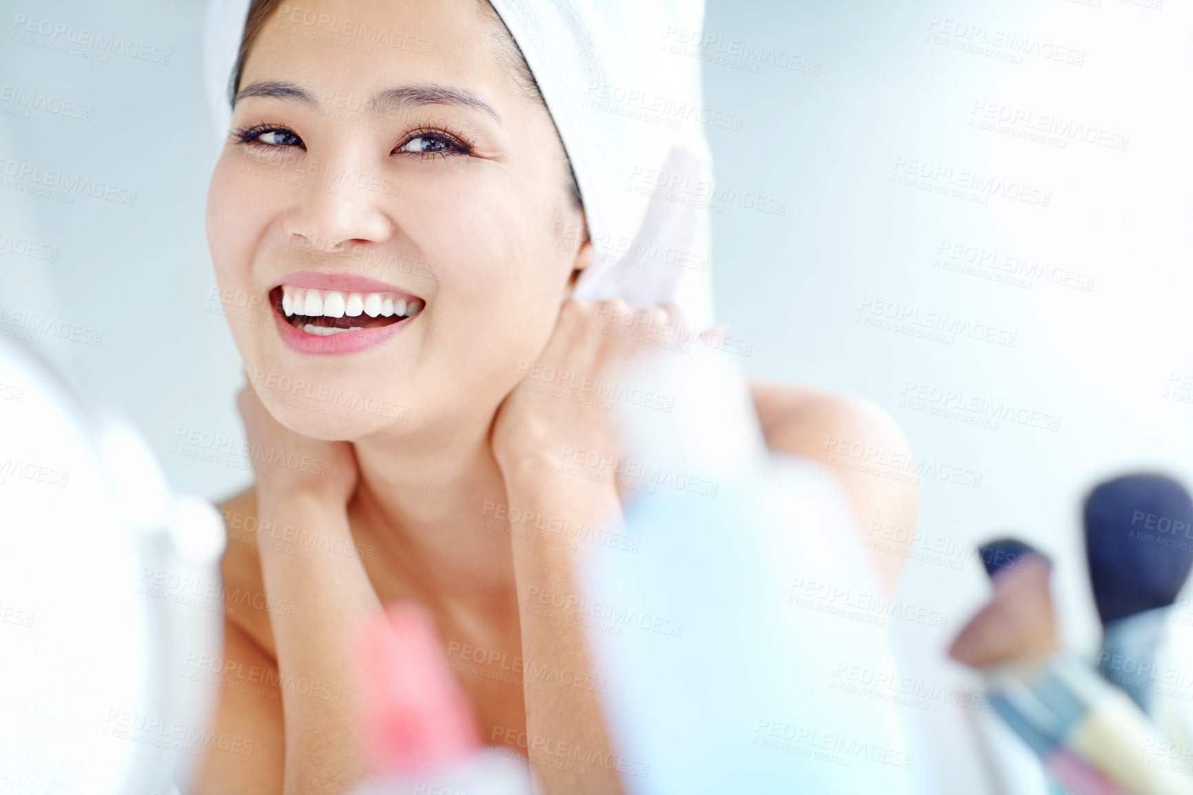 Buy stock photo Asian woman, bathroom and cosmetics with smile, face or moisturizer bottle for change with mirror in home. Person, towel and grooming routine for skincare, excited and product for beauty in morning