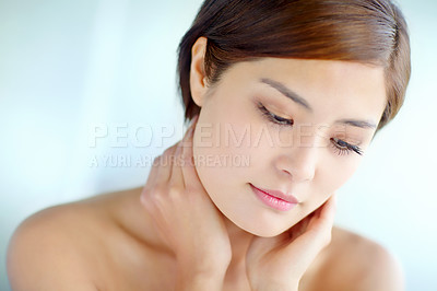 Buy stock photo Asian woman, vision and touch for skincare, dermatology and beauty in studio with healthy skin. Female person, thinking and hygiene routine on blue background for facial treatment, self care and glow