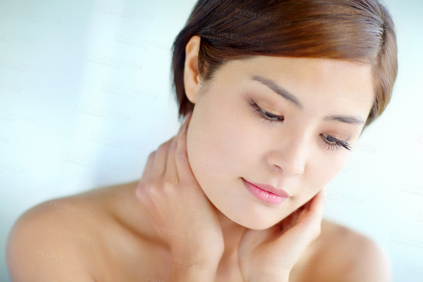 Buy stock photo Asian woman, vision and touch for skincare, dermatology and beauty in studio with healthy skin. Female person, thinking and hygiene routine on blue background for facial treatment, self care and glow