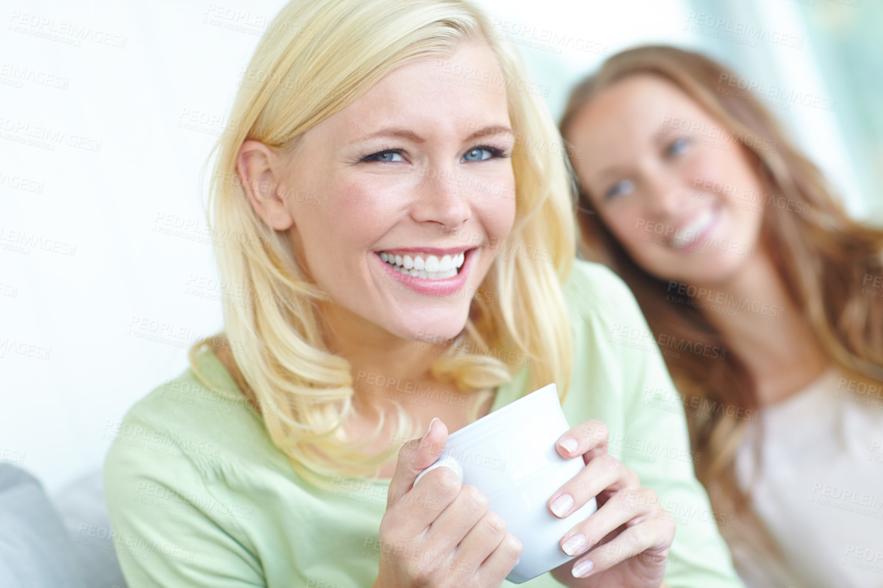 Buy stock photo Portrait, coffee and girl friends on sofa with smile, fun and bonding together on weekend morning in home. Relax, drink and happy women on couch with comedy, reunion and laughing in living room 