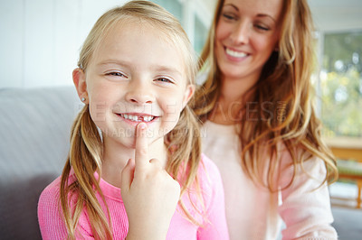 Buy stock photo A cute little girl spending time with her mom at home