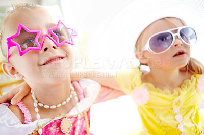 Buy stock photo Fancy, friends and kids dress up in home with fun, glamour and confidence with sunglasses for character play. Princess, costume and happy girl children with smile, fantasy and creative development.