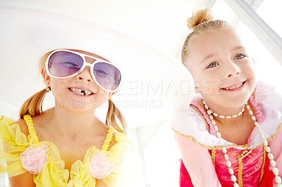 Buy stock photo Princess, sisters and portrait of kids in home with fun, glamour and confidence with sunglasses for character play. Fancy, dress and happy girl friends with smile, fantasy and creative development.