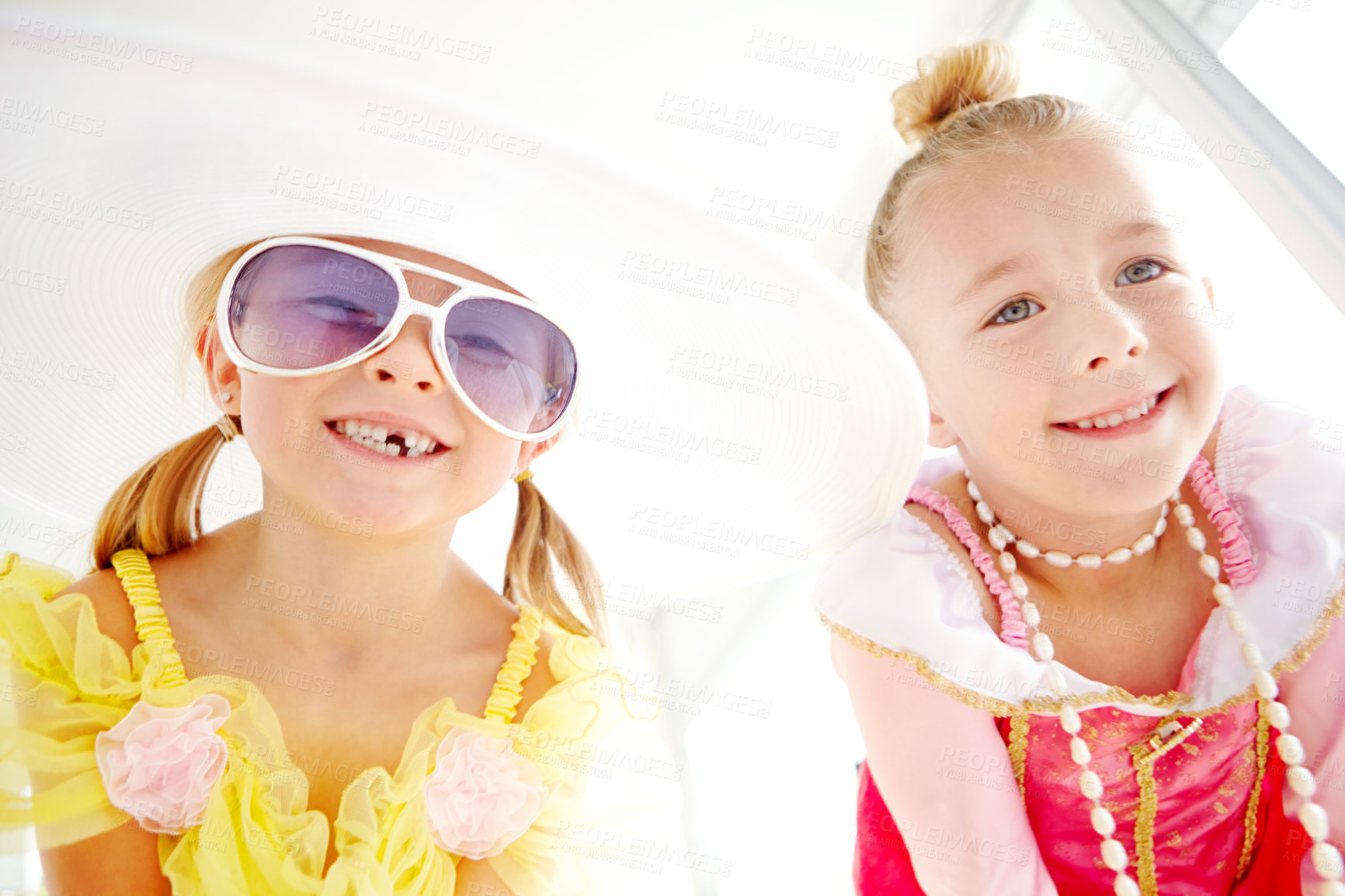 Buy stock photo Princess, sisters and portrait of kids in home with fun, glamour and confidence with sunglasses for character play. Fancy, dress and happy girl friends with smile, fantasy and creative development.