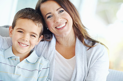 Buy stock photo Happy mother, child and hug on sofa for love, support or care with bonding for childhood or weekend together at home. Portrait, mom and kid or son with smile for embrace or relax on living room couch