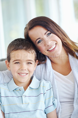 Buy stock photo Mother, child and hug on sofa for love, support or care with bonding for happy childhood or weekend together at home. Portrait, mom and kid or son with smile for embrace or relax on living room couch