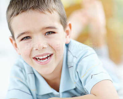 Buy stock photo Home, happy and portrait of child with smile for weekend enjoyment, break and satisfaction in morning. Relax, boy and face of kid with joy on floor of house for development, wellness and fun in peace