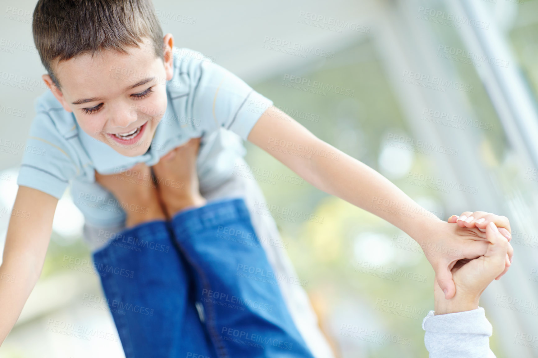 Buy stock photo Smile, parent and lifting child in home with feet for game, balance and family bonding together for support. Happy kid, playing and flying with babysitter in air, holding hands and young boy laughing