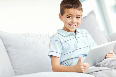 Buy stock photo Portrait, tablet and happy child in home for relax, reading ebook or boy streaming anime in living room. Face, tech or kid on sofa with learning app for education, watch show or cartoon on internet