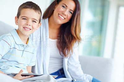 Buy stock photo Mother, son and tablet on sofa for film, online cartoon or internet with entertainment for childhood together at home. Portrait, mom and kid or child with smile for hug and relax on living room couch