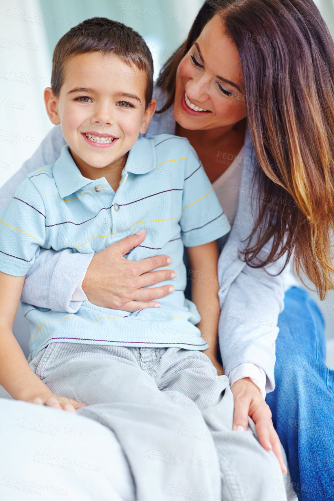 Buy stock photo Hug, portrait and smile of boy with mother on sofa in living room of home together for bonding. Family, love or relax with happy son and single parent woman embracing in apartment on weekend