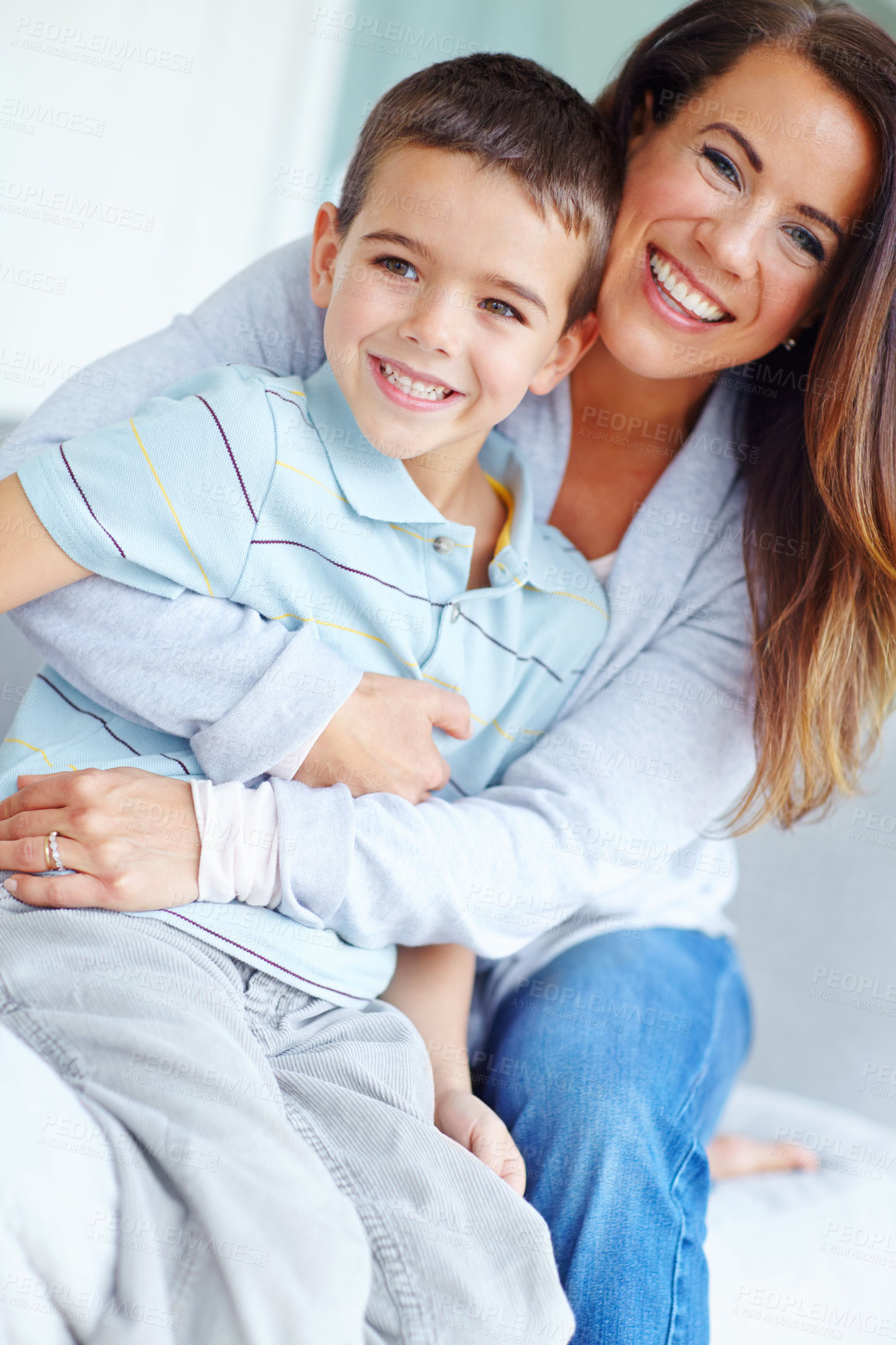 Buy stock photo Mom, child and hug on living room sofa for love, support or care for bonding or happy childhood on weekend together at home. Portrait, mother and kid or son with smile for embrace or relax in lounge