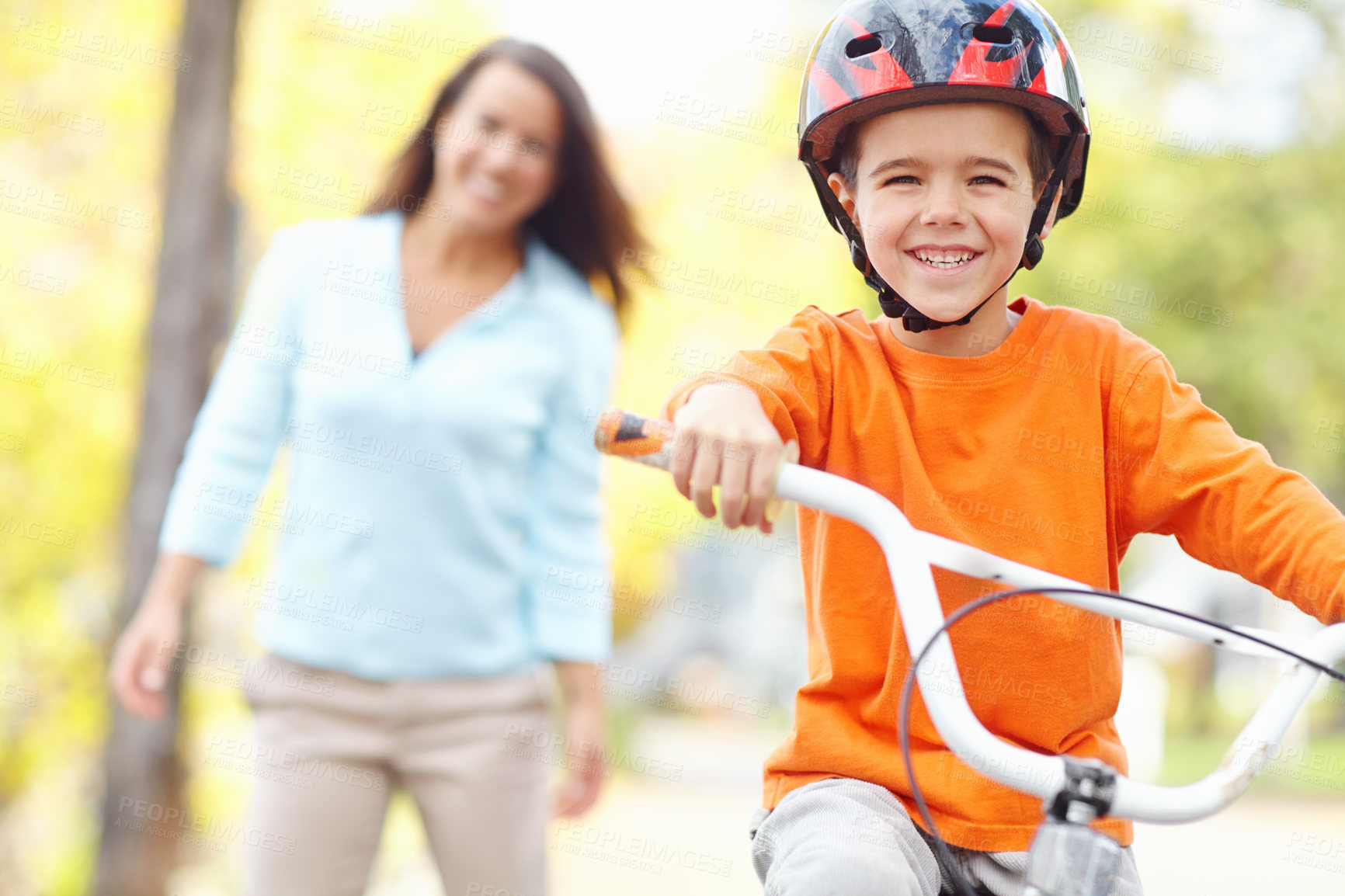 Buy stock photo Bicycle, learning and portrait of boy with mother outdoor on street of neighborhood for child development. Balance, happy or smile with single parent woman teaching son how to ride bike in summer