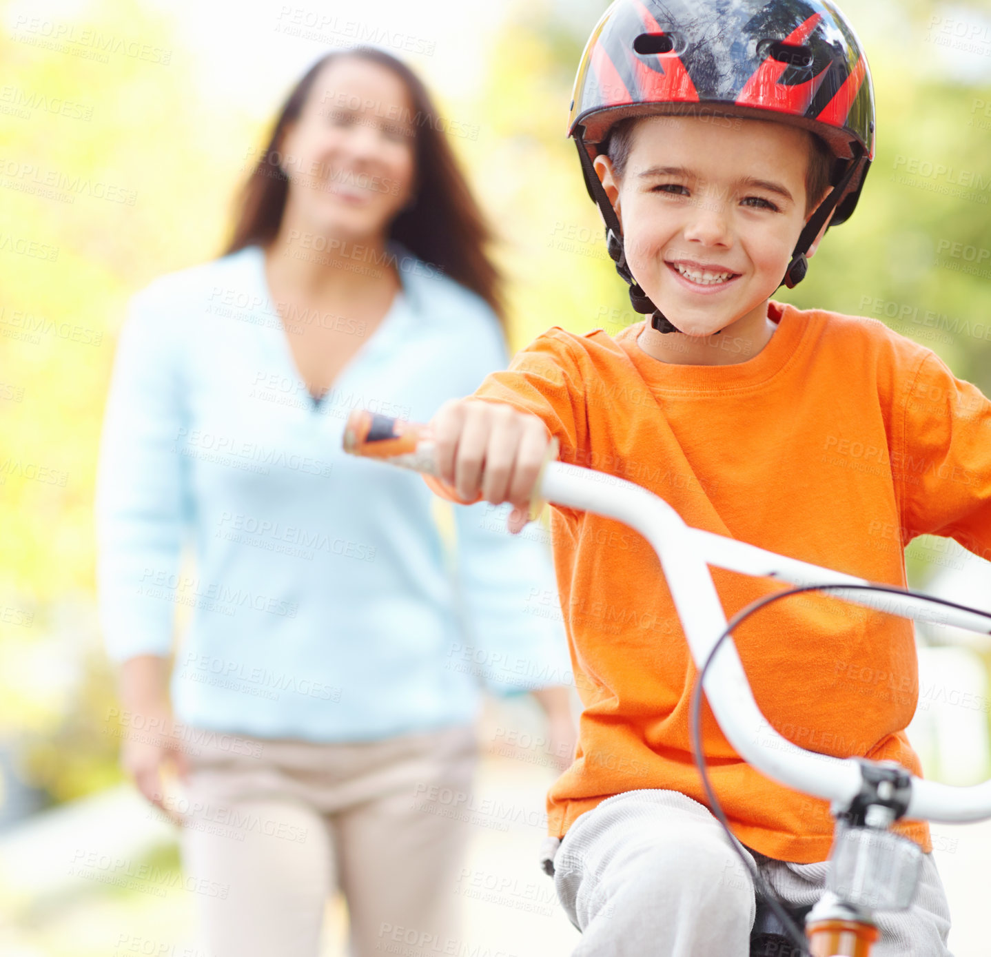 Buy stock photo Bike, learning and portrait of boy with mom outdoor on street of neighborhood for child development. Balance, love or smile with happy single parent woman teaching son how to ride bicycle in summer