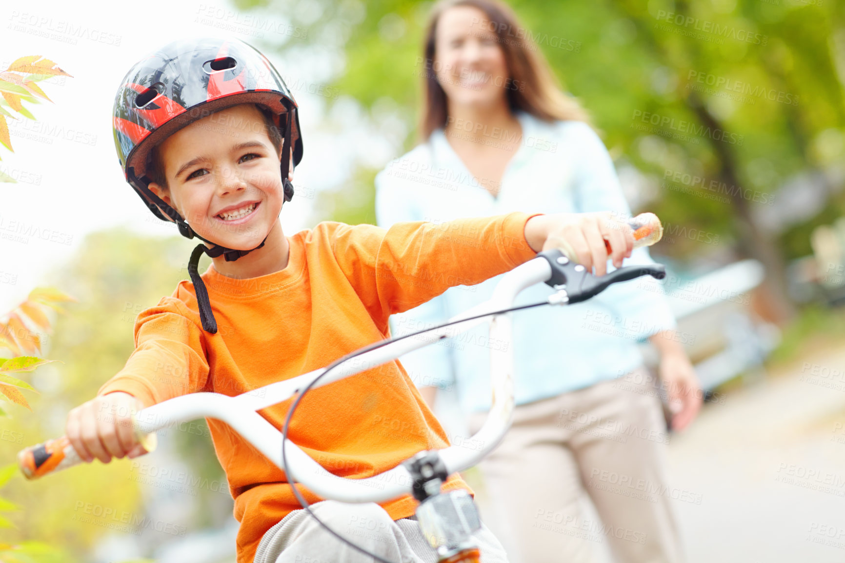 Buy stock photo Cycling, learning and portrait of boy with mother outdoor on street of neighborhood for child development. Happy, safety or smile with single parent woman teaching son how to ride bike in summer