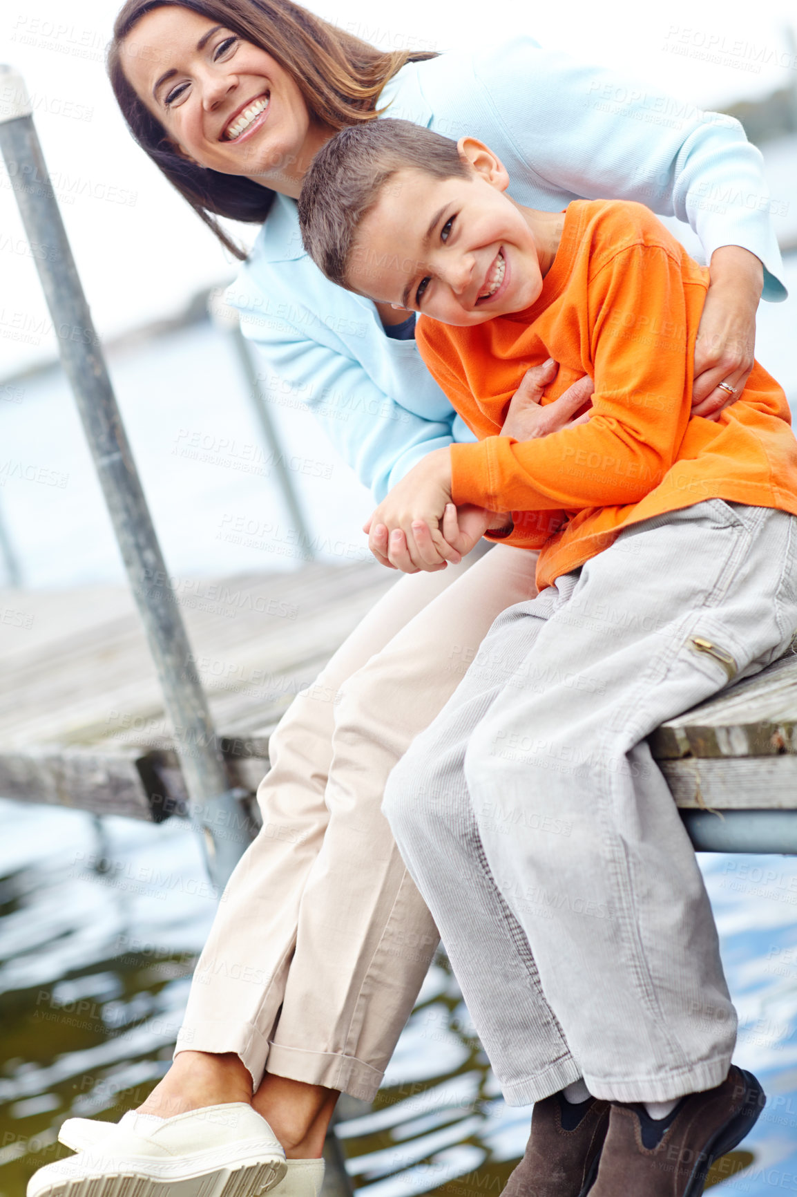 Buy stock photo Happy, mother and kid on dock for portrait, love and tickling on harbour on vacation. Family, mom and child at ocean for holiday, bonding and relationship development with trust and support in Canada