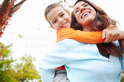 Buy stock photo Mom, boy and happy in outdoor on piggyback for fun with bonding, support and care for break. People, parent and smile with kid for child development, growth and childhood memories in England