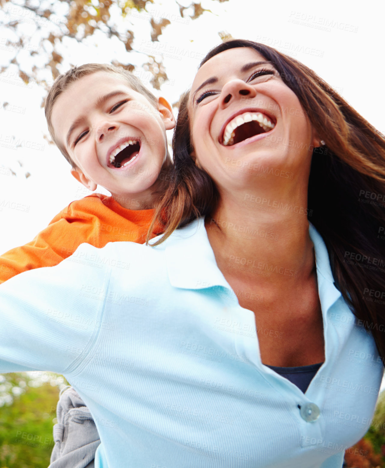 Buy stock photo Mom, boy and outdoor with flying on piggyback for fun on portrait with bonding, support and care. Low angle, parent and happy or smile with kid for child development, growth and childhood memories