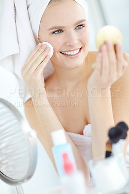 Buy stock photo Smile, girl and cleaning face for skincare with cotton pad, facial hygiene and wipe makeup of dermatology. Woman, product and cosmetic for natural benefits, glow results and beauty mirror at house